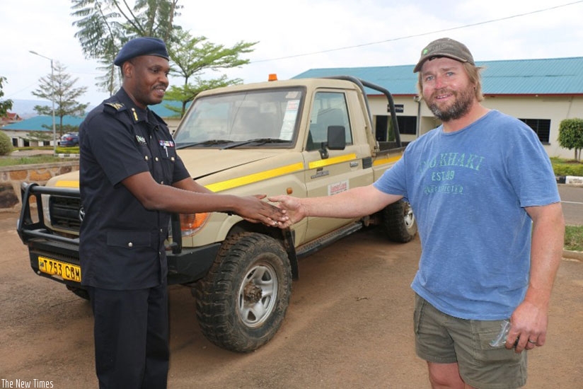 South African national Bernard Kobus receives the keys to his truck that he lost five over years ago. Three stolen vehicles were returned to South African owners by Rwanda National....