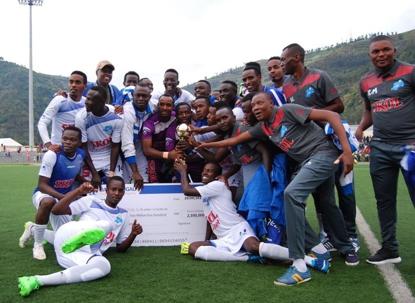 Rayon Sports players and officials celebrate after winning inaugural FEZA Cup following a 2-0 victory over Etincelles on Wednesday at Umuganda Stadium. / Courtesy
