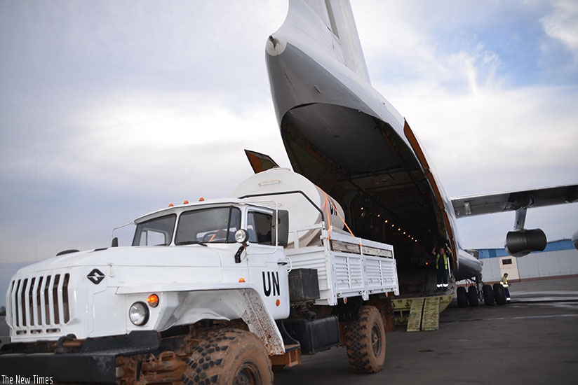 A military truck is loaded on to a cargo aircraft at the Kigali International Airport en route to Bangui, CAR. Courtesy. 