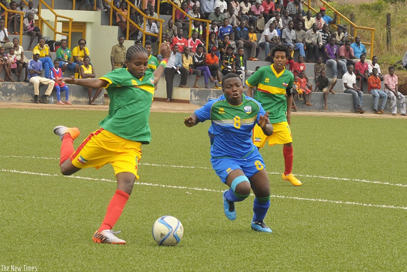 Ethiopia's Emebet Addidu, left, shoots as Rwanda's Florence Imanizabayo  closes during last year's Group B match that She-Amavubi lost 3-2. / File photo