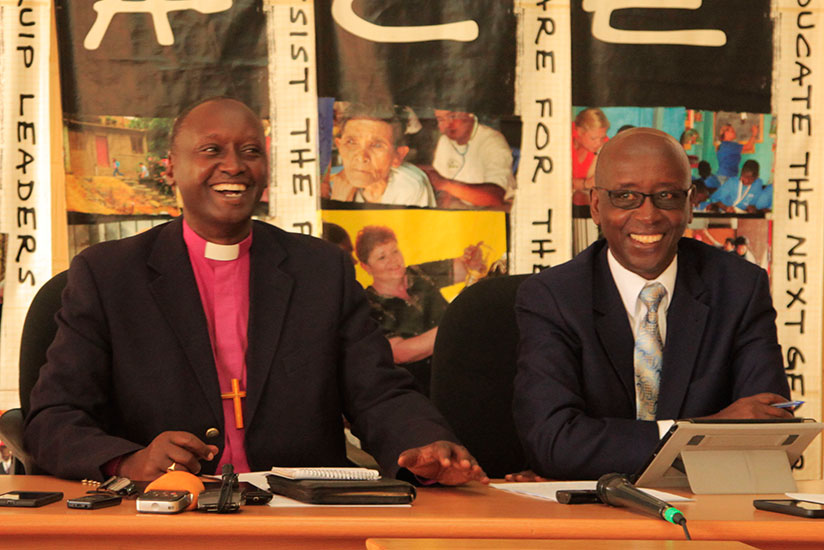 Bishop Birindabagabo shares a smile with Theophile Kamanzi, Rwanda Shima Imana coordinator. Birindabagabo said that the ceremony will be celebrated at village level to allow all Rw....