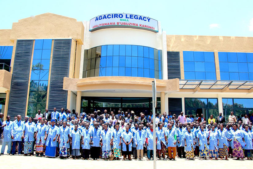 Community Health Workers stand in front of their newly built Agaciro Legacy Mall. / Courtesy