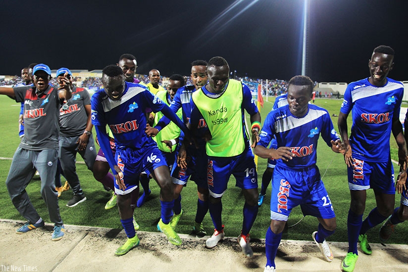 Midfielder Pierrot Kwizera (2nd from right) is joined by his Rayon Sports teammates to celebrate the second goal against APR FC at Umuganda Stadium on Saturday. Sam Ngendahimana