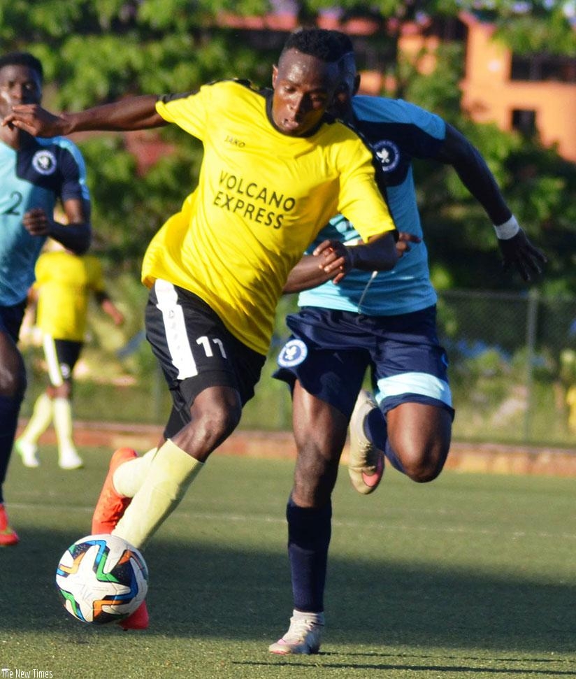Mukura striker Yussuf Habimana tries to go past a Police FC defender during a league game last season. Mukura could pull out of the league for next season due to financial crisis. ....
