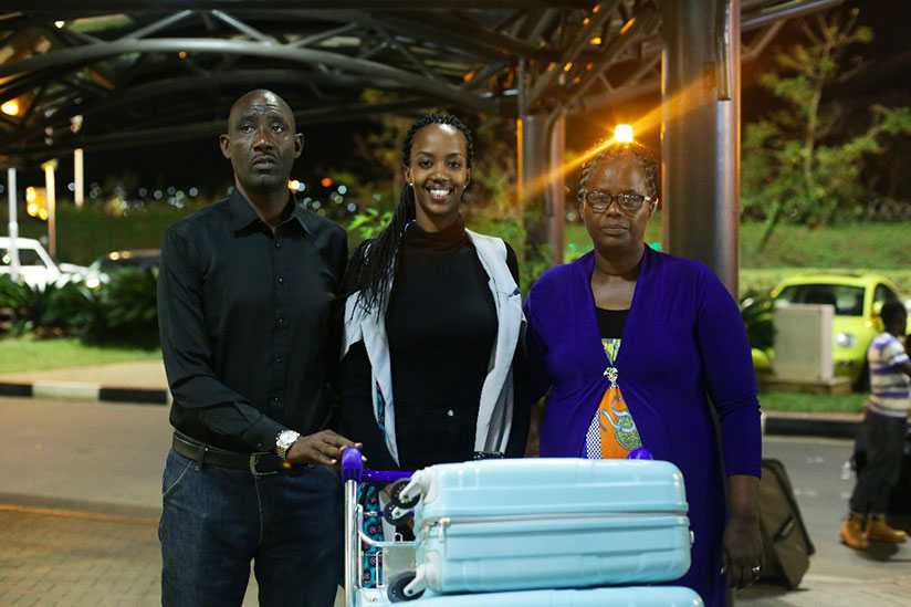 Miss Rwanda Elsa Iradukunda with her parents at Kigali International Airport. / Courtesy