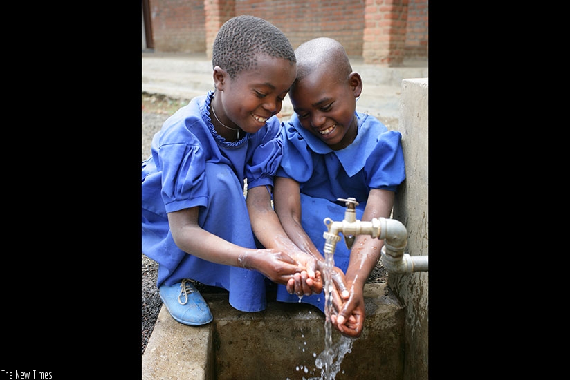 Children washing hands. Clean water is an important part of life. Clean water keeps our bodies healthy. What can you do to help keep water clean?  (u00a9UNICEF Rwanda/2013/Pirozzi)