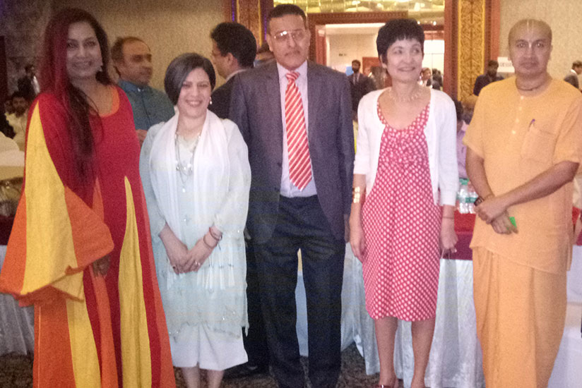 Rwanda Renaissance's Fernandes (middle) and some of the guests pose for a photo. (Courtesy)