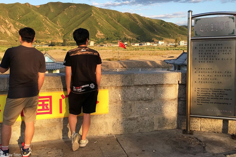 Tourists in China look across to North Korea border from Tumen. China is North Korea's main trading partner and top diplomatic ally. Net photo.