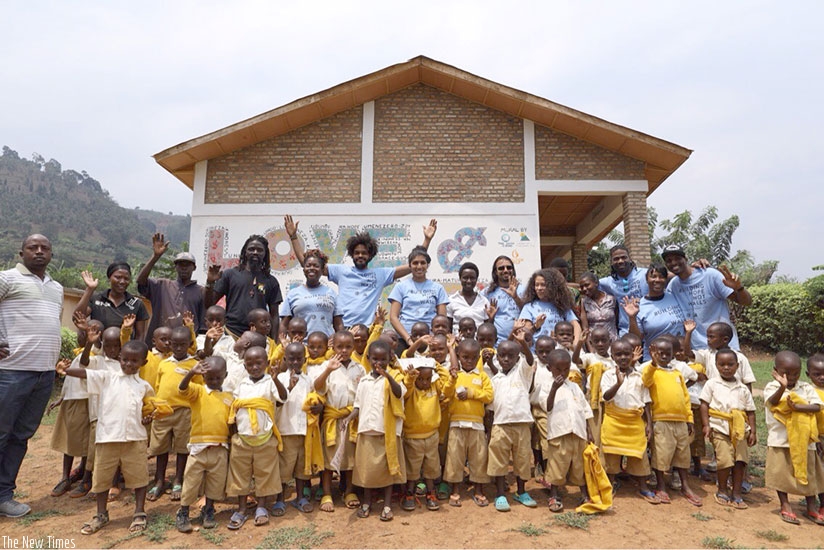 Kigali and Chicago artists pose for the photo with school children in Rwesero, Northern Province. / All pictures courtesy of Cam Be.