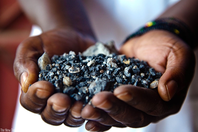 A miner displays minerals at Gatumba Mineral Site. The Chief Executive of Rwanda Mines, Petroleum and Gas Board, Francis Gatare, has said that the Government's recent announcement ....