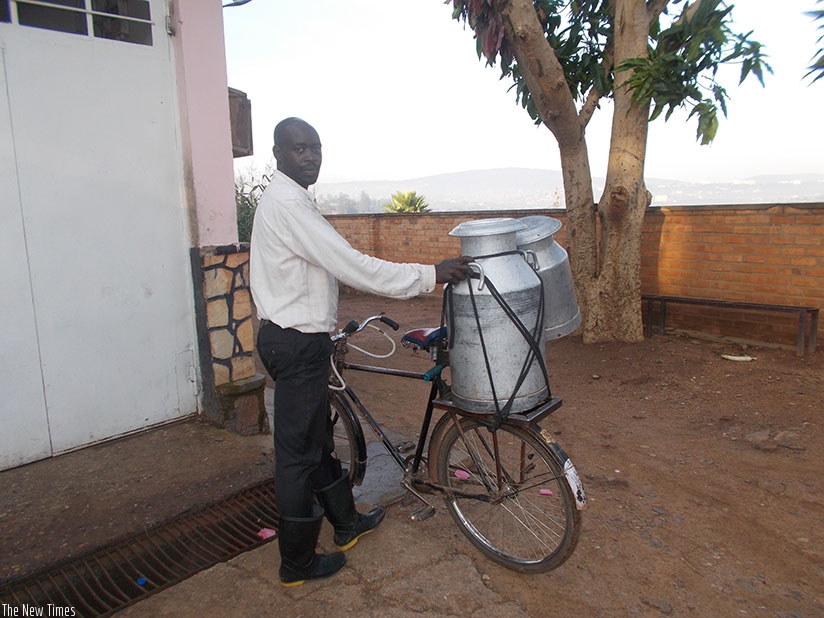 A man delivers milk at a collection centre in Kigali. Rwanda seeks to promote trade in processed milk to increase stakeholder benefits. / Elias Hakizimana