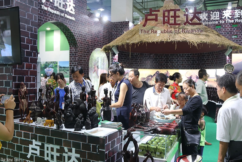 Showgoers admire handicrafts that were exhibited at the expo in South China. / Richard Ruhimbana