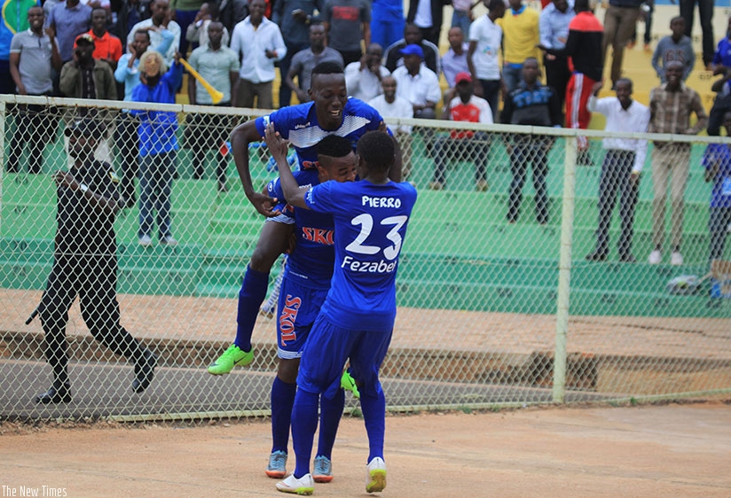 Rayon Sports goal scorer, Caleb Musabyimana, celebrates with teammates Yannick Mukuzi and Pierrot Kwizera. / Sam Ngendahimana