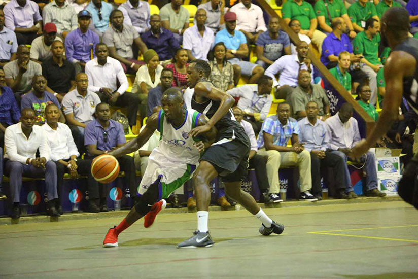 Patriot's Steven Havugintwari tries to block a City Oilers player on Tuesday night at Lugogo Indoor Arena. / Usher Komugisha