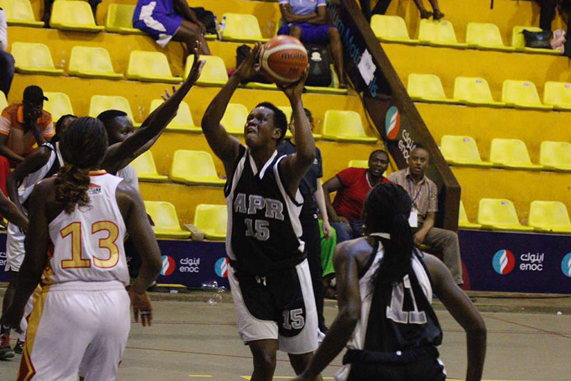 APR skipper Charlotte Umugwaneza, with the ball, scored 14 points on Wednesday. Courtsey