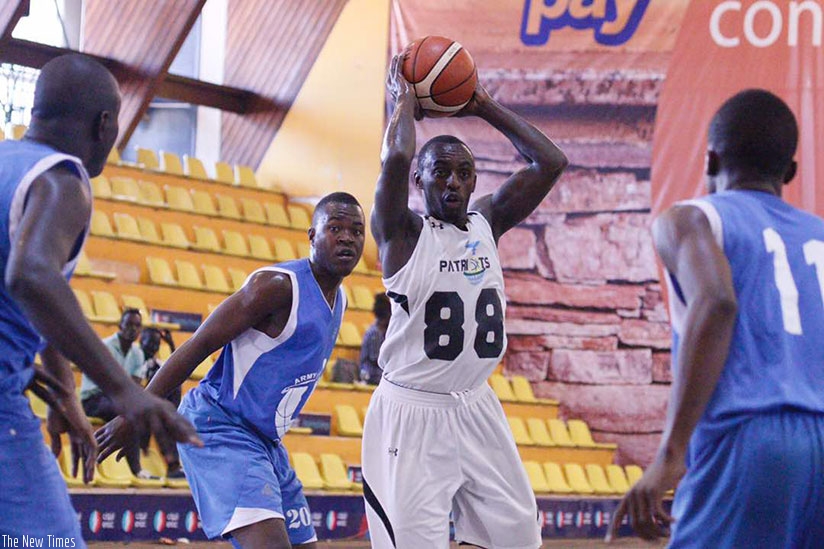 Patriots' captain Aristide Mugabe looks to pass the ball to a teammate during the quarter-final game against ABC of Tanzania on Thursday evening in Kampala. (Courtesy)