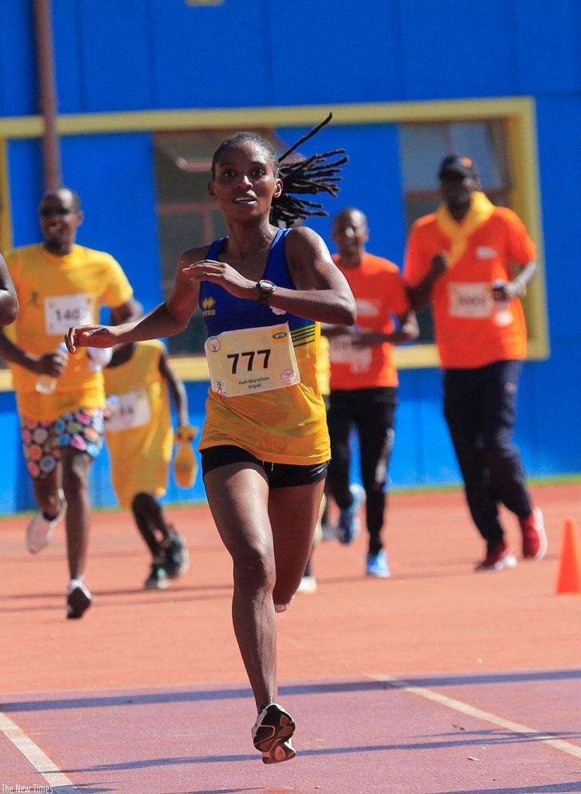 Salome Nyirarukundo crosses the finish line to win this year's Kigali International Peace half marathon in May. / File