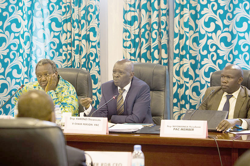 The chairperson of the Parliamentary Public Accounts Committee (PAC), Theoneste Karenzi (centre), addresses officials from Rwanda Development Board (not in picture), while PAC chai....