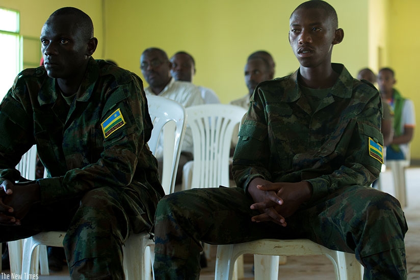 Privates Nshimiyumukiza (L) and Ishimwe before the military court during the judgement yesterday. The two soldiers were convicted of murder and face life in prison. / Timothy Kisambira