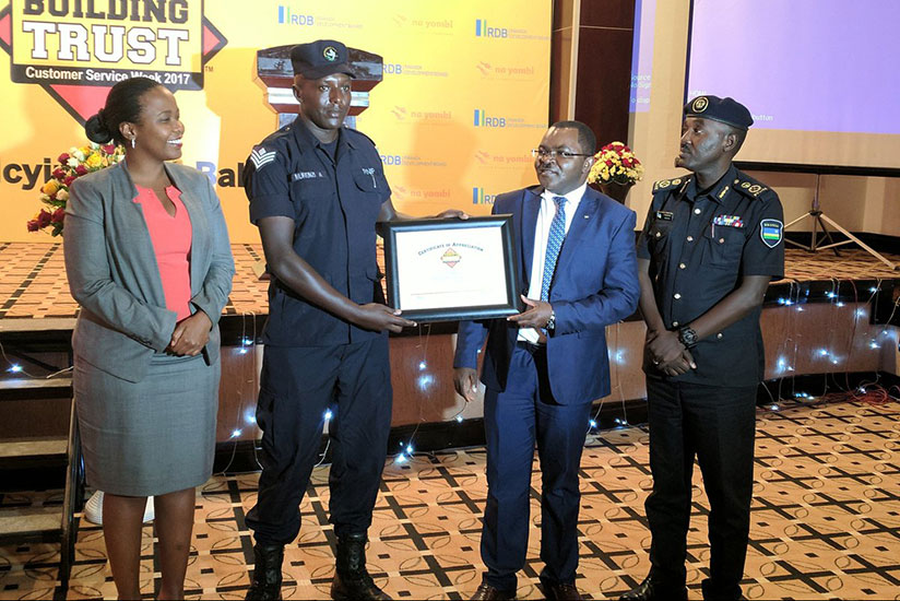Senior Sergeant Alexis Murenzi who works with the Rwanda National Police's Traffic department receiving an award for the Customer Service Champion 2017. / Courtesy