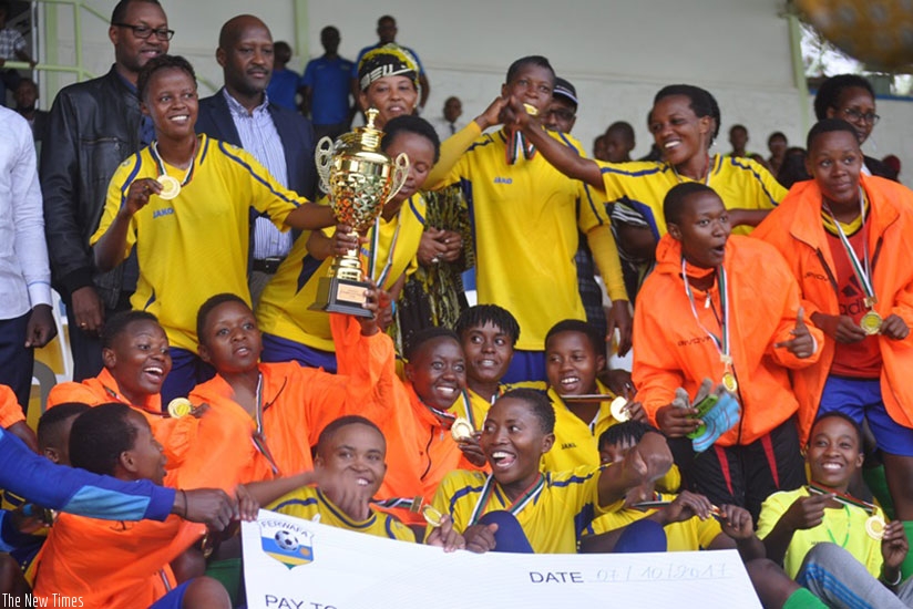 AS Kigali players and officials celebrate after capturing a record-extending 9th Women's football league title on Saturday. Courtesy