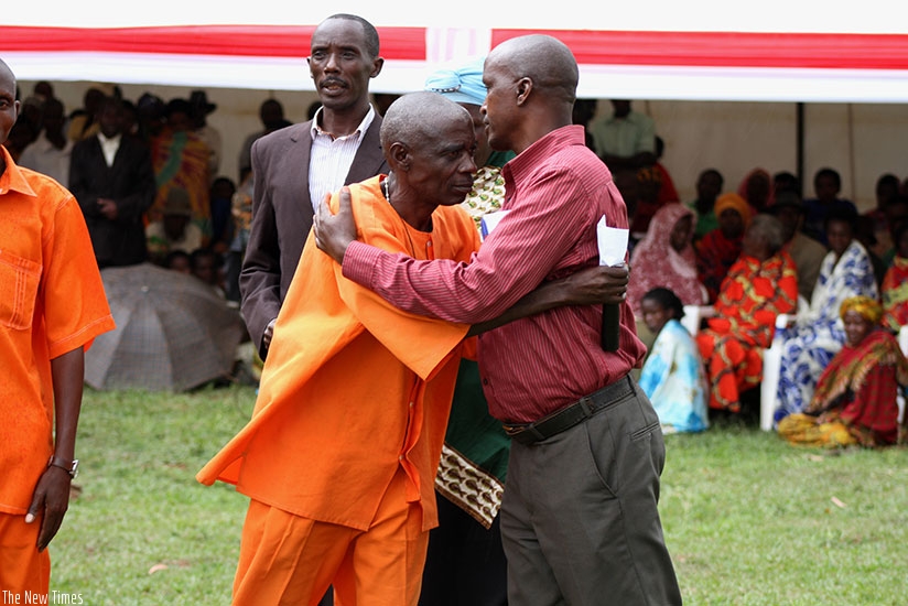 Genocide prisoner Evariste Buregeya embraces a survivor in Nyamirama Sector during a confession and forgiveness giving event last week. Emmanuel Ntirenganya.