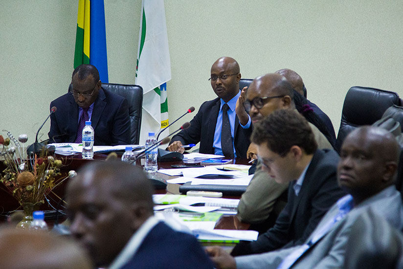 Yusuf Murangwa, the General Director of NISR, speaks as finance minister Claver Gatete looks on. (Timothy Kisambira)