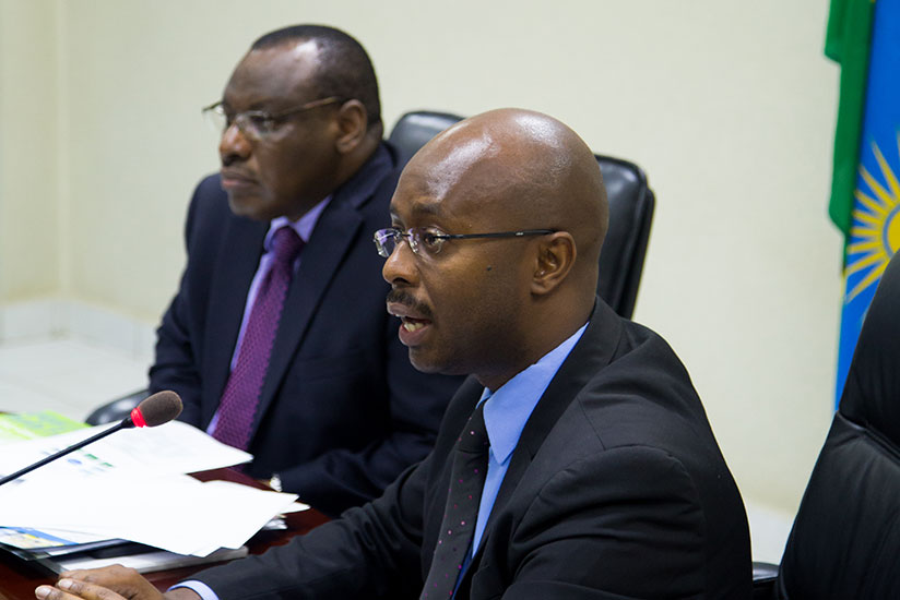 Yusuf Murangwa, the director-general of the National Institute of Statistics of Rwanda (NISR), explains findings of a new survey during the release in Kigali yesterday. Looking on ....