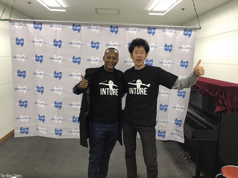 Kabera with one of the writers at the film festival. / Courtesy