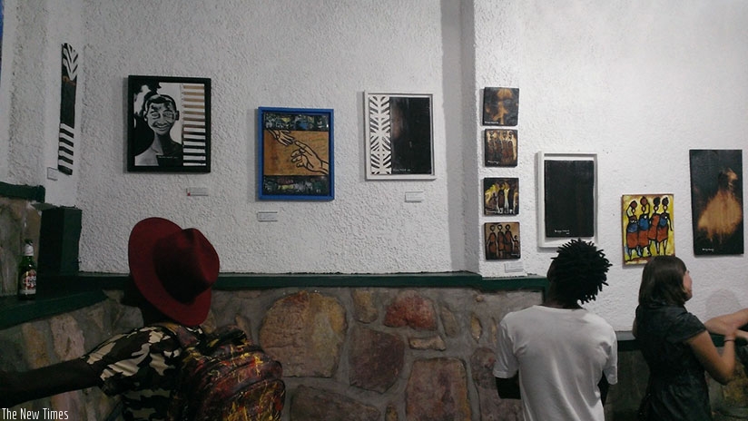 Guests admire  the images on display. ( Photos by Moses Opobo)