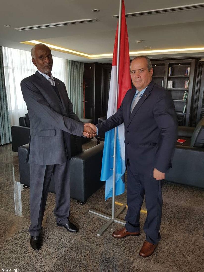 RPF Secretary General Francois Ngarambe and the Cuban envoy, Antonio Luis Pubillones Izaguirre after their meeting in Rusororo yesterday. (Courtesy)
