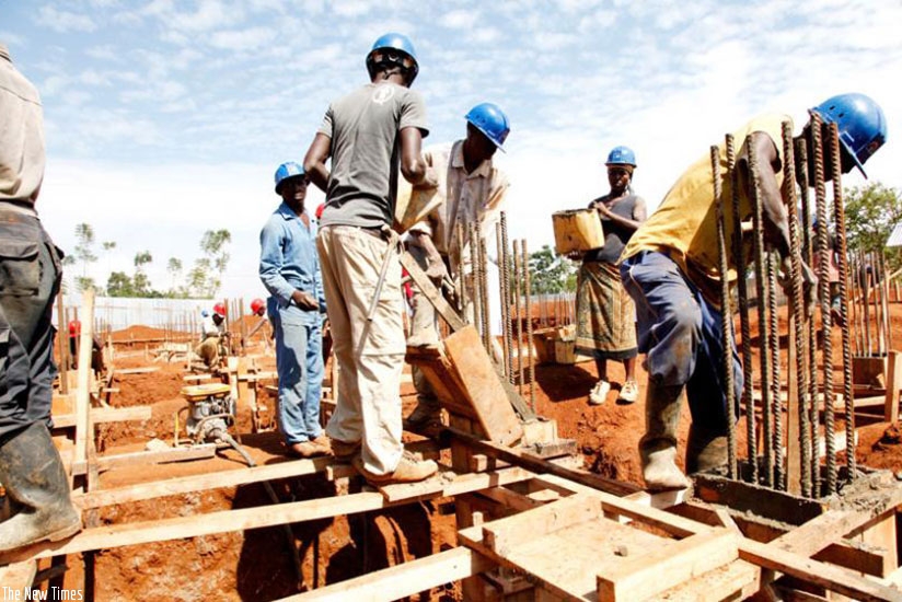 Workers at a construction site in Kigali. Contractors have often been accused of not paying their employees. (File)