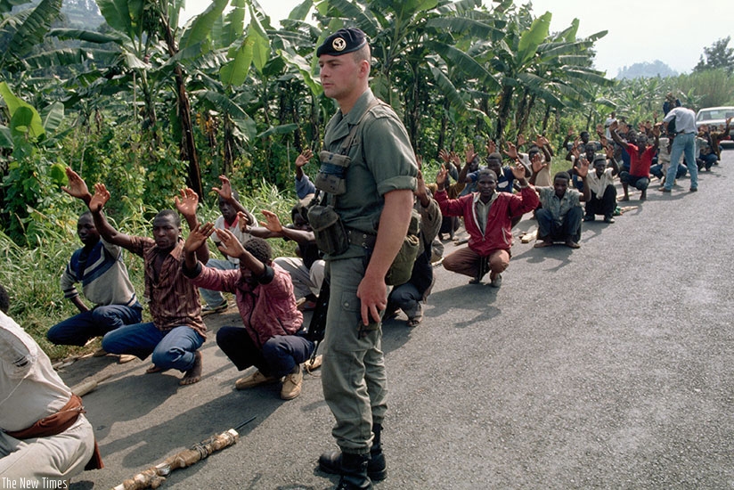 A French soldier supervises the training of Interahamwe militiamen. The Interahamwe killed more than 1 million Tutsi during the Genocide (File)