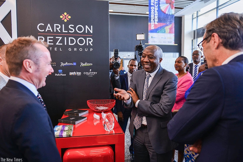 Premier Ngirente visits stands during hospitality exhibition at the opening of Africa Hotel Investment Forum at Kigali Convention Centre yesterday. (N. Imbabazi)