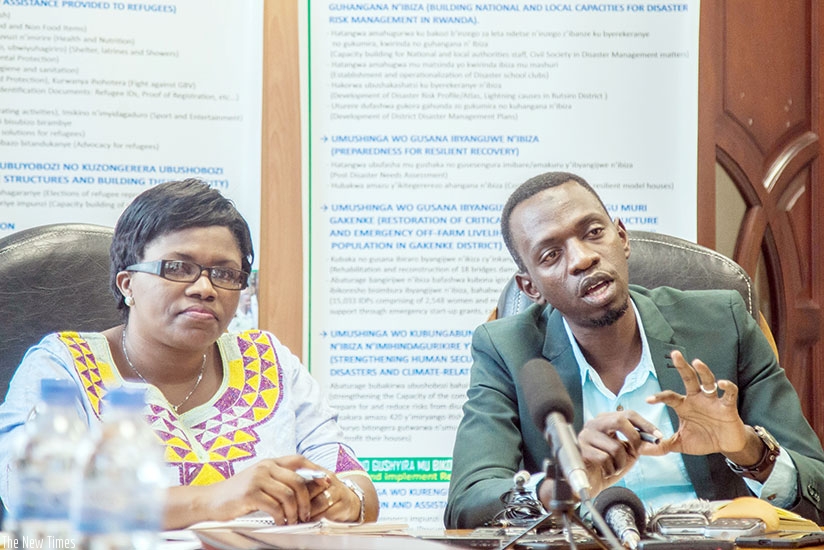 Nshimiyimana (R) addresses the media as Debonheur listens. Nadege Imbabazi.