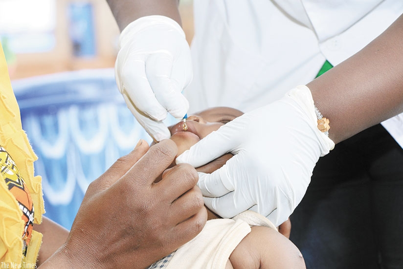 A nurse administers a vaccine to a baby during the launch of Health Week in Kirehe District on Wednesday. The Ministry of Health targets to offer measles and rubella vaccines to mo....