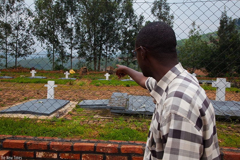 A Genocide survivor points to the spot at a Catholic parish in Nyange in Ngororero District where he suspects a bulldozer to have buried members of his family during the 1994 Genoc....