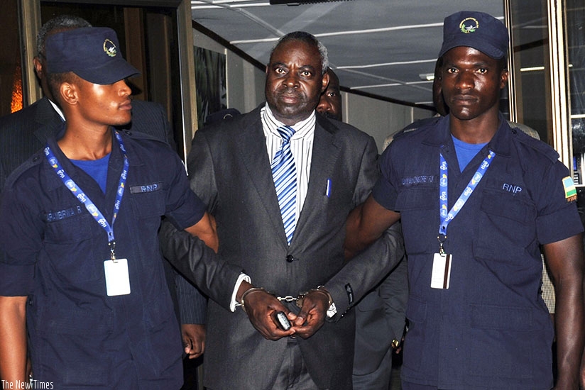 Genocide suspect Bernard Munyagishari arrives at Kigali International Airport in August. File.
