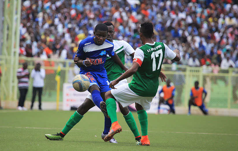 Rayon Sports forward Shassir Nahimana gets sandwiched by two SC Kiyovu players including skipper Fabrice Mugheni during the match at Kigali Stadium. / Sam Ngendahimana