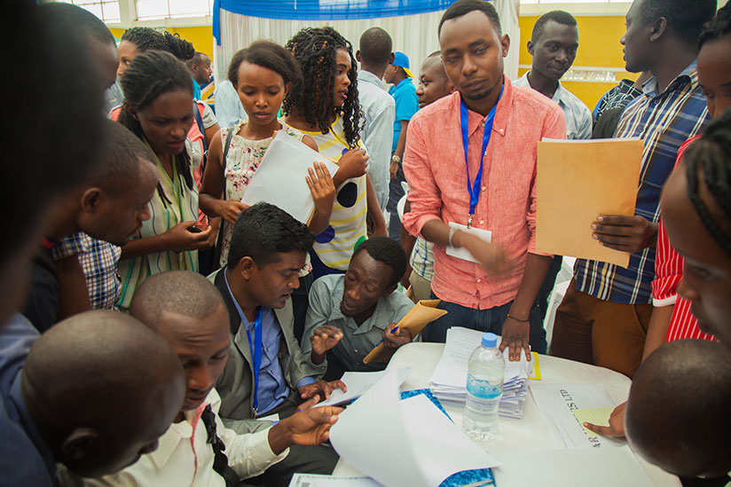 Youth submit applications during a job fair in Kigali. Some companies still discriminate female applicants. / File