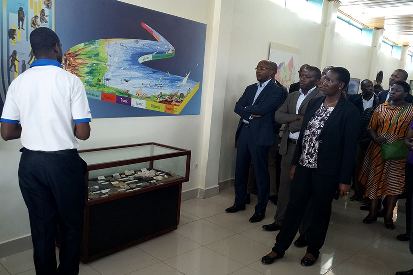 Uwacu (R) and other officials tour the museum during the launch of new artifact. / Jean d'Amour Mbonyinshuti