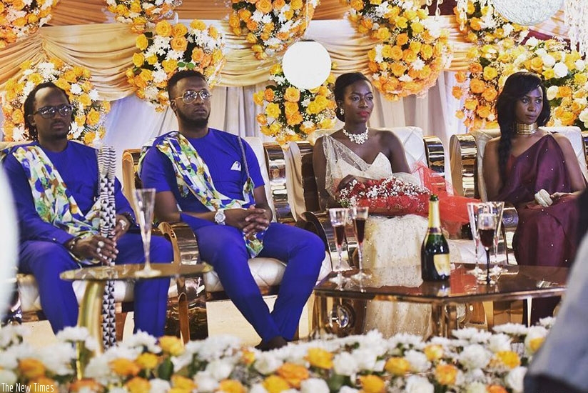 Safi and Niyonizera on their giveaway ceremony, flanked by their best man and maid of honour. (Courtesy)
