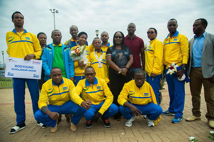 The para taekwondo team pose for a group photo at Kigali International Airport after returning from the World Taekwondo Championships where they won two medals. / Kisambira Timothy