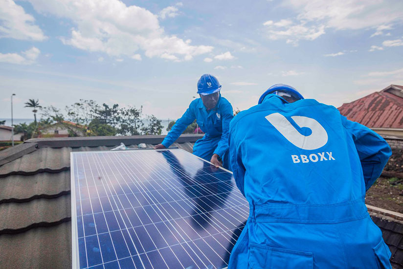 BBOXX technical team install a solar panel on the house. With government subsidy, more homes could get  connected to on-grid solution.