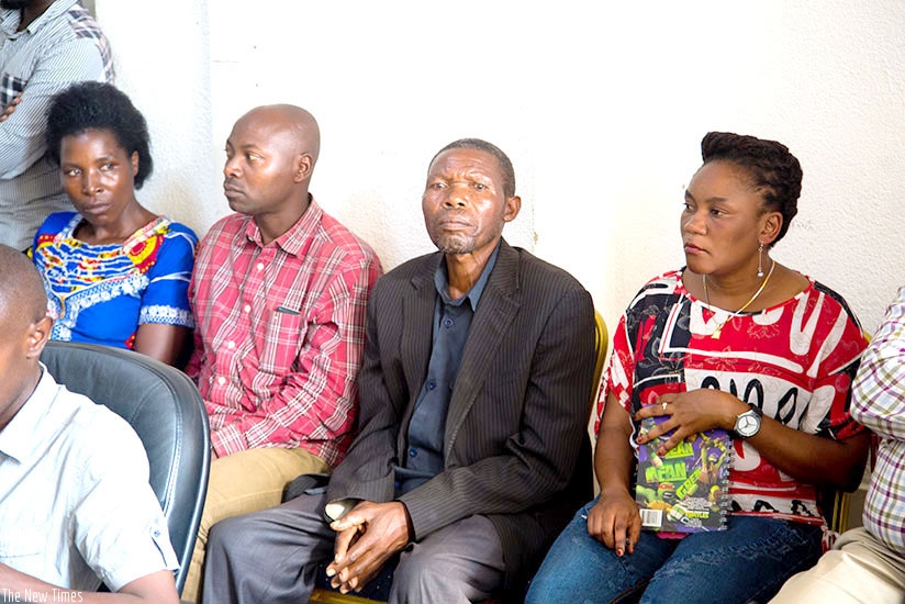 Alphonse Majyambere (second right), one of the seven Rwandans that Human Rights Watch falsely claimedrnhad been killed by the countryu2019s security forces, and relatives of the othe....
