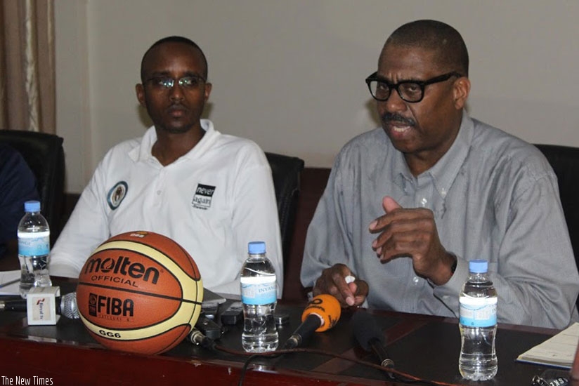Joseph Wright Joby (R) was yesterday relieved of his duties as National Technical Director. Left is Basketball Federation Secretary General Richard Mutabazi. (Courtesy)