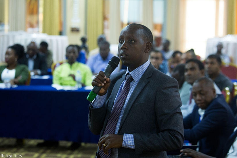 William Musoni, the RRA deputy commissioner for customs services, makes a presentation at the event yesterday. (Timothy Kisambira)