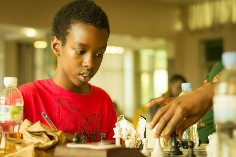 Ian Urwintwari Murara, 15, playing in a tournament early this year. The grade 11 student of Wellspring Academy is one of the country's top young chess players. / Courtesy