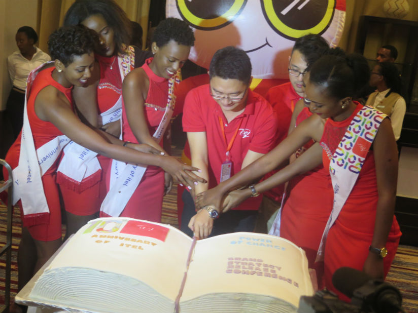 Itel Rwanda staff cutting the cake during the anniversary celebrations. (All photos by Eddie Nsabimana)