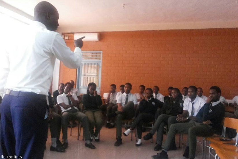 A teacher addresses students. Parents should complement teachers by being good role models to their children. (Lydia Atieono)